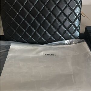 Black puffy leather zip clutch bag